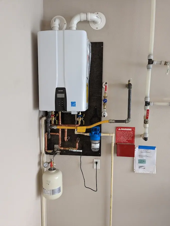 Professional plumber installing copper piping in a Deltona home